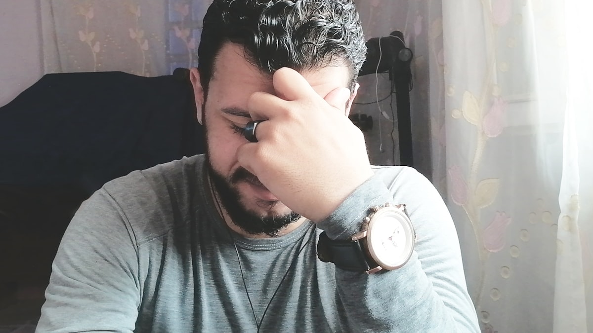 South Asian business owner frustrated at desk after Udyam Registration rejection — PAN-Aadhaar mismatch errors are common